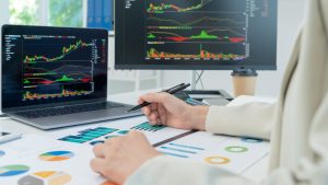 person calculating a cost Benefit analysis of hiring a managed service provider