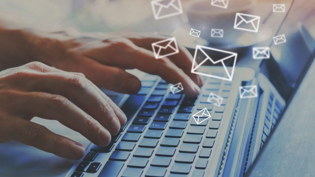 person on the computer answering emails